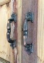 Old steel handles on wooden cupboard Royalty Free Stock Photo