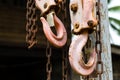 Old steel hook with hanging chain suspended Royalty Free Stock Photo