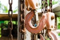 Old steel hook with hanging chain suspended Royalty Free Stock Photo