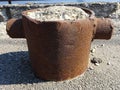 Old steel metal single mooring vessel bollard bitt