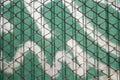 Old steel net with green zinc wall Royalty Free Stock Photo