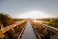 Old steel railway bridge on the river with beautiful sunset Royalty Free Stock Photo