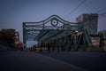 Old steel road bridge in evening time, night lights. Don valley, Toronto, Ontario