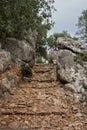Old steep path with steps made of rock Royalty Free Stock Photo