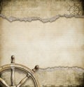 Old steering wheel and torn nautical map