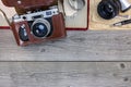 Old still camera in leather case, photo album and old pictures o Royalty Free Stock Photo