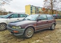 Old veteran brown Toyota Corolla hatchback private car parked