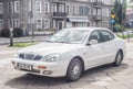 Old white Daewoo Leganza limousine sedan parked