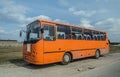 Old Polish school bus orange Autosan front and left side view parked Royalty Free Stock Photo