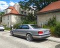 Classic old sedan car BMW 750 V12 rear part and left side view parked