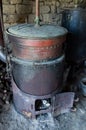 Old still with wood heater for making fruit alcohol in a craft distillery