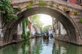 Old stone arch bridge over a canal in the watertown Tongli, China