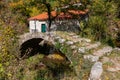 Old stone arched bridge covered with moss over Seljani stream in idyllic village Poseljani in Lake Skadar National Park Royalty Free Stock Photo