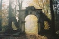 an old stone archway in the middle of a forest Royalty Free Stock Photo