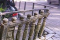 An old stone balustrade in need of repair and restoration. Dilapidated fence. Close-up, selective focus Royalty Free Stock Photo