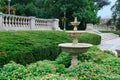 Old stone bird bath and stone balustrade