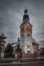 Old stone and brick church with clock tower in Bialka Tatrzanska, Poland Royalty Free Stock Photo