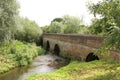 Old Stone Bridge, with arches over River Arrow, Alcester, Warwickshire, UK