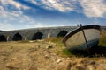 Old stone bridge and old boat