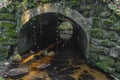 Old stone bridge over Konsky creek in winter day in Sumava national park