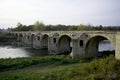 Old stone bridge over large river Royalty Free Stock Photo