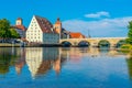 Old stone bridge over river Danube in Regensburg, Germany Royalty Free Stock Photo