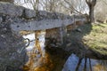 Old stone bridge over a river Royalty Free Stock Photo