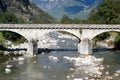 Old stone bridge over river Ticino at Biasca Royalty Free Stock Photo