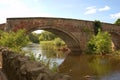 Old stone bridge over river Tyne, Haddington in summer