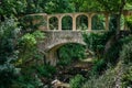 Old stone bridge over the stream Royalty Free Stock Photo