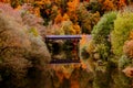 An old stone bridge in autumn. Royalty Free Stock Photo