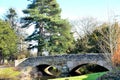 old stone bridge and tree reflections in a river Royalty Free Stock Photo