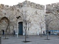 Old stone building with an open gate in the centre Ierusalima early morning in spring