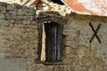 Old stone building ruin with wooden window