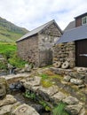 Old stone buildings in Trollanes village on the Kalsoy Island, Faroe Islands