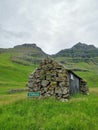 Old stone cottage in Trollanes village on the Kalsoy Island, Faroe Islands