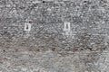 Old stone castle wall texture, cannon windows Royalty Free Stock Photo