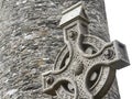 Old stone celtic cross in a traditional irish graveyard