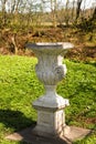 An old stone chalice sculpture in barrock park