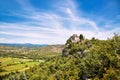 An old stone chapel, a church or a monastery standing on the edge of a rock. Beautiful view from the mountain to the valley of th Royalty Free Stock Photo