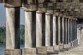 Old stone columns. Ancient colonnade. Corridor with columns Royalty Free Stock Photo