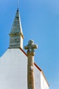 Old stone cross and roof Royalty Free Stock Photo