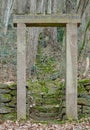 Amorbach, Germany, 19 Jan 2020: Old stone door in the middle of the forest in a winter sunny day