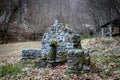 Old stone drinking fountain in the forest Royalty Free Stock Photo