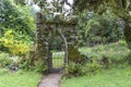 Old stone entrance gate in the garden.