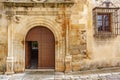 Old stone facade with wooden door Royalty Free Stock Photo