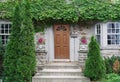 Old stone faced house covered in ivy Royalty Free Stock Photo