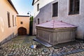 Old stone fountain on beautiful cobbled street, Tabor, Czech Republic