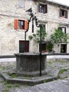 Old stone fountain in the central square in Buzet