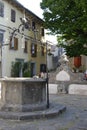 Old stone fountain in the central square in Buzet